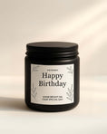 Custom message candle for 30th birthday celebration, set on rustic background.